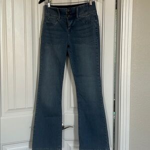 Laurie Felt Silky Curve Baby  Boot Cut Jeans in Medium Blue. Size S